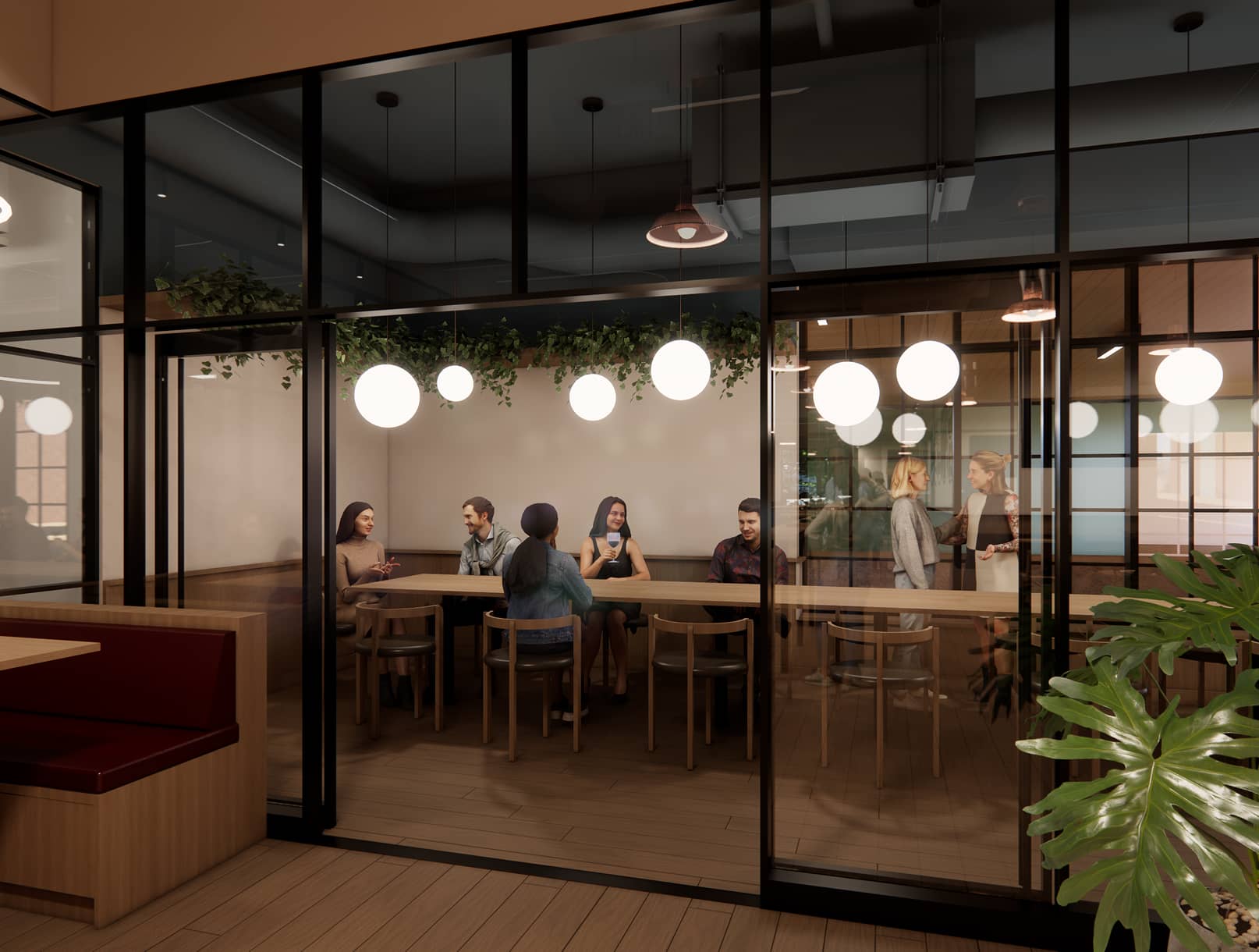 Interior shot of patrons sitting at a long table with circular lighting pendants.