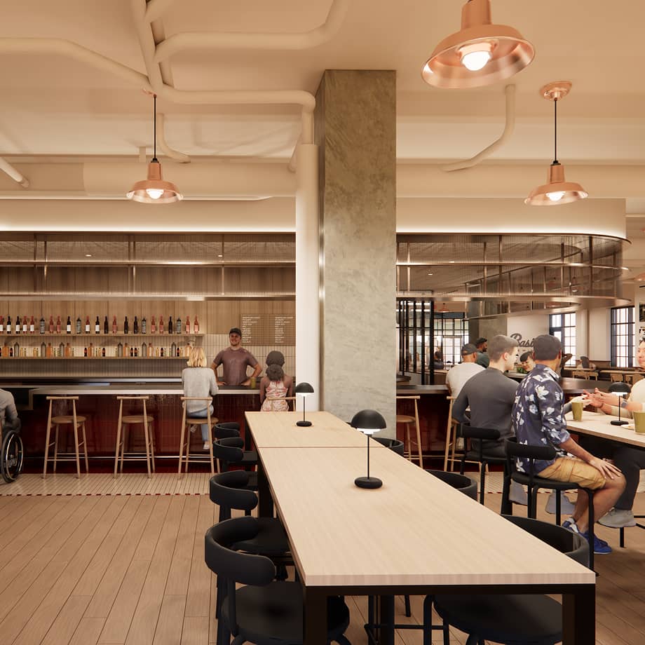 Interior shot of brewing with patrons at long tables inside the brewery.