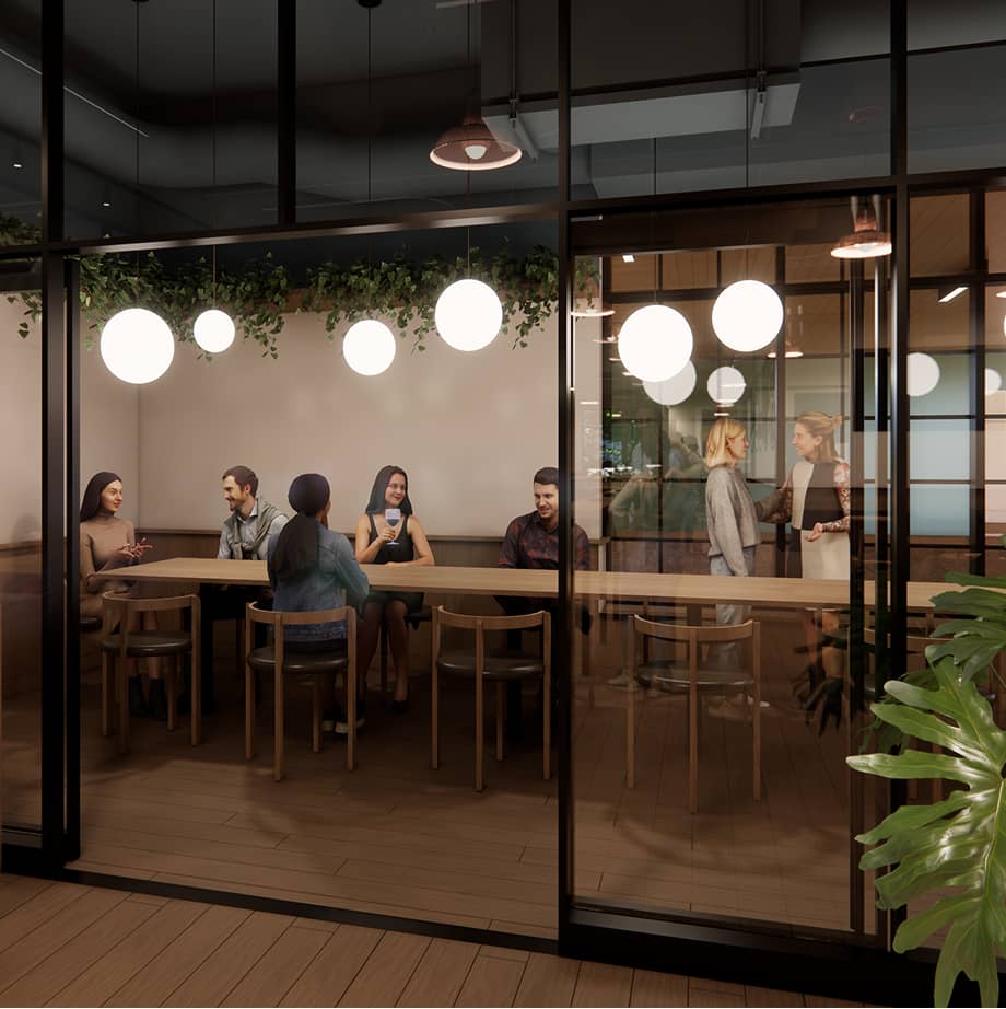 Interior shot of brewing with patrons at a high table under circular lighting fixtures.