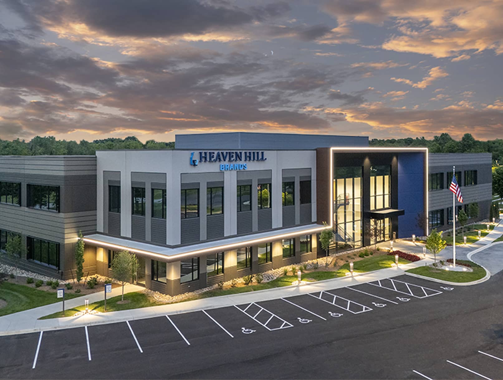 Aerial shot of 815 Building at dusk with light details highlighting walkway and entrance.