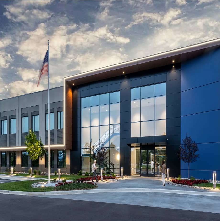 815 Building entrance with curtain wall near door.