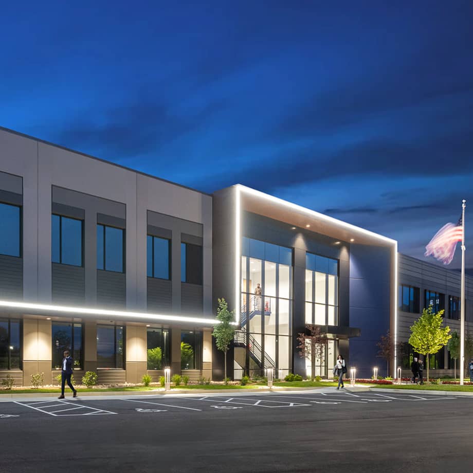815 Building at night with lightning detail outline the entrance.