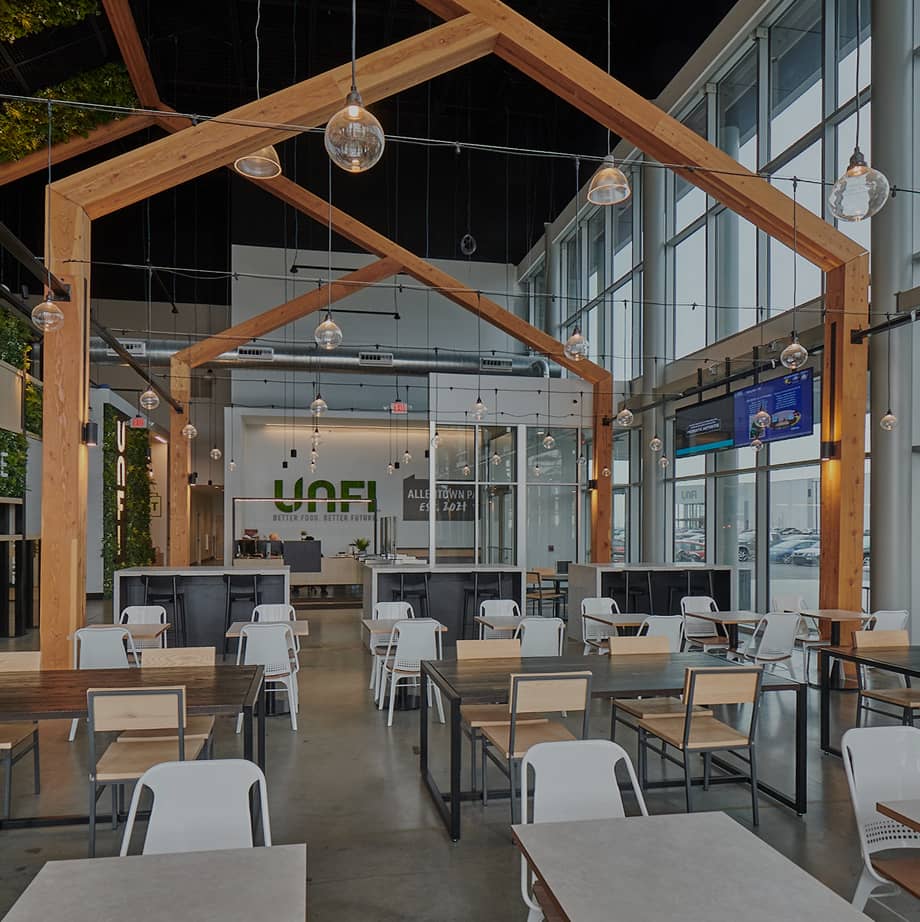 Interior shot of UNFI with wooden gable arch detail.
