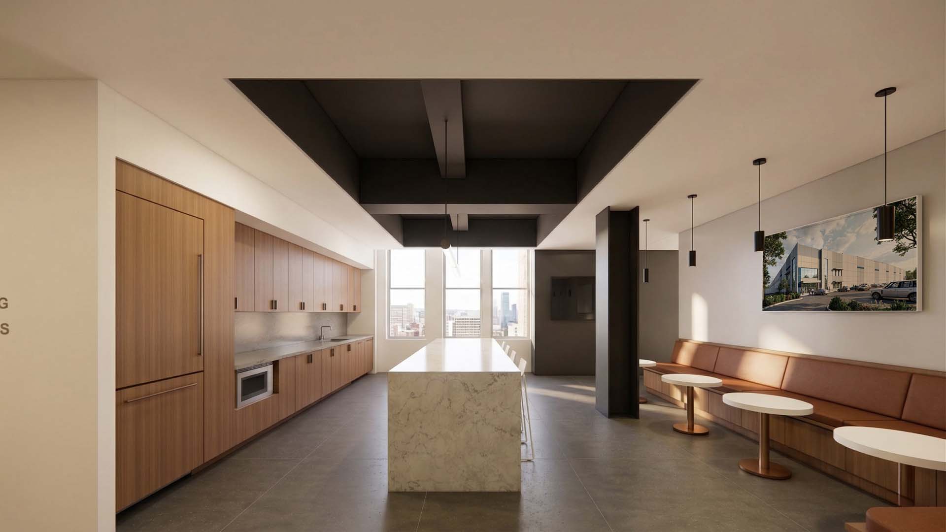 Break room kitchen with marble island, wood cabinetry, and banquette seating with city views.