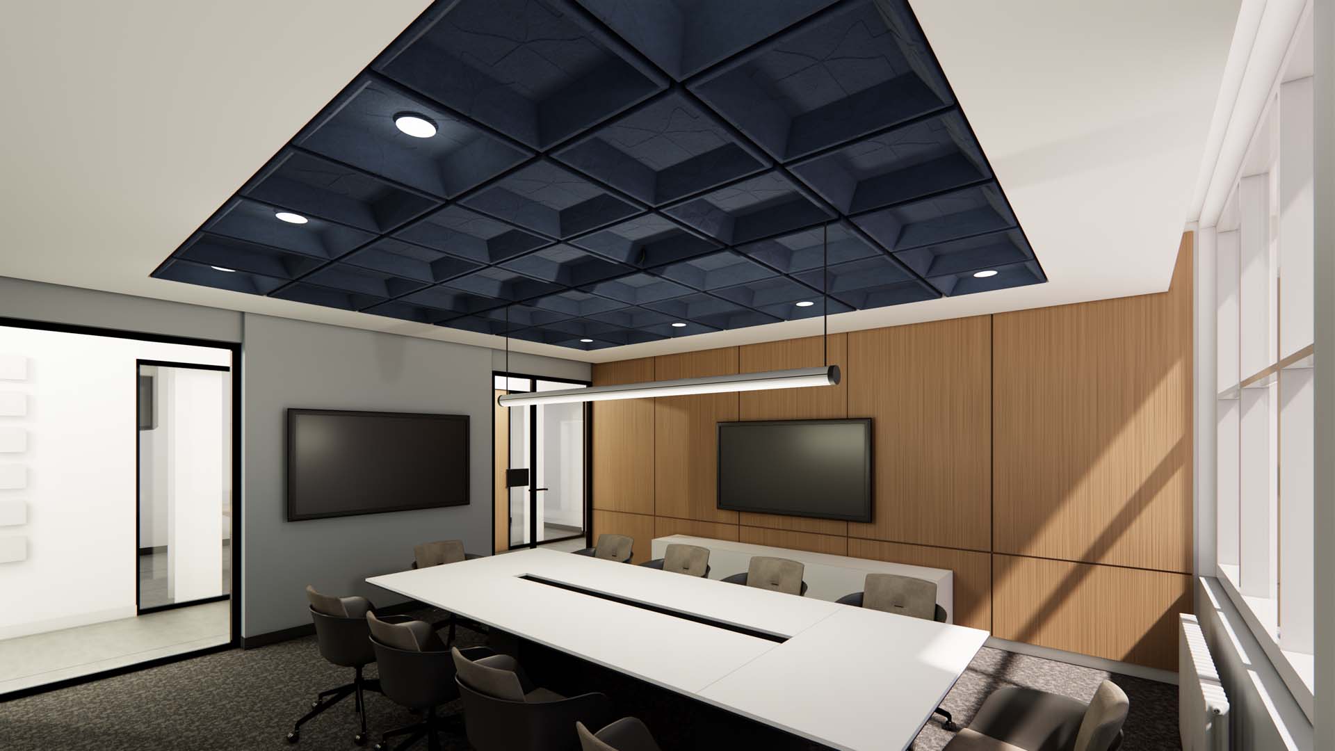 Conference room with geometric ceiling panels, white table, and dual wall-mounted screens.