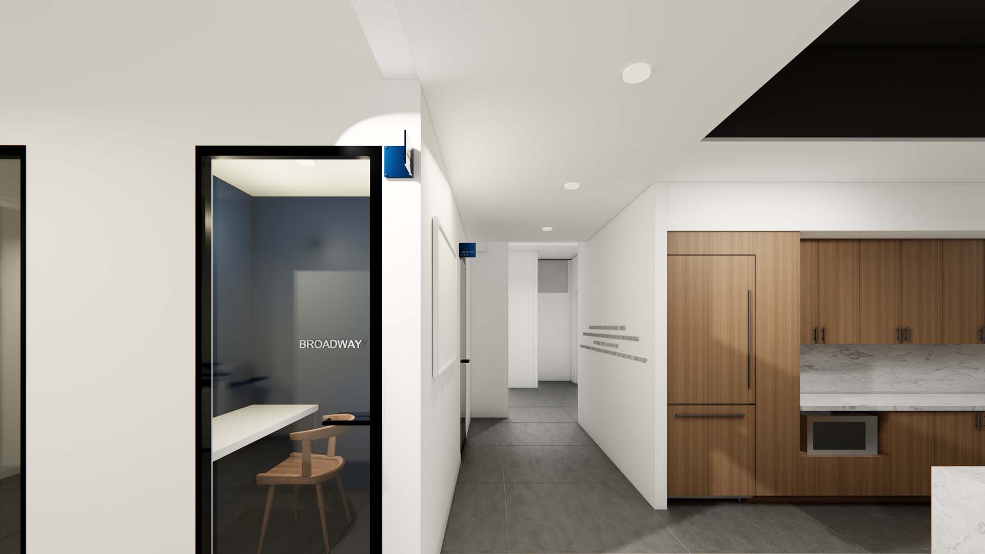Hallway with glass phone booth, hardwood kitchen cabinetry, and marble countertop.