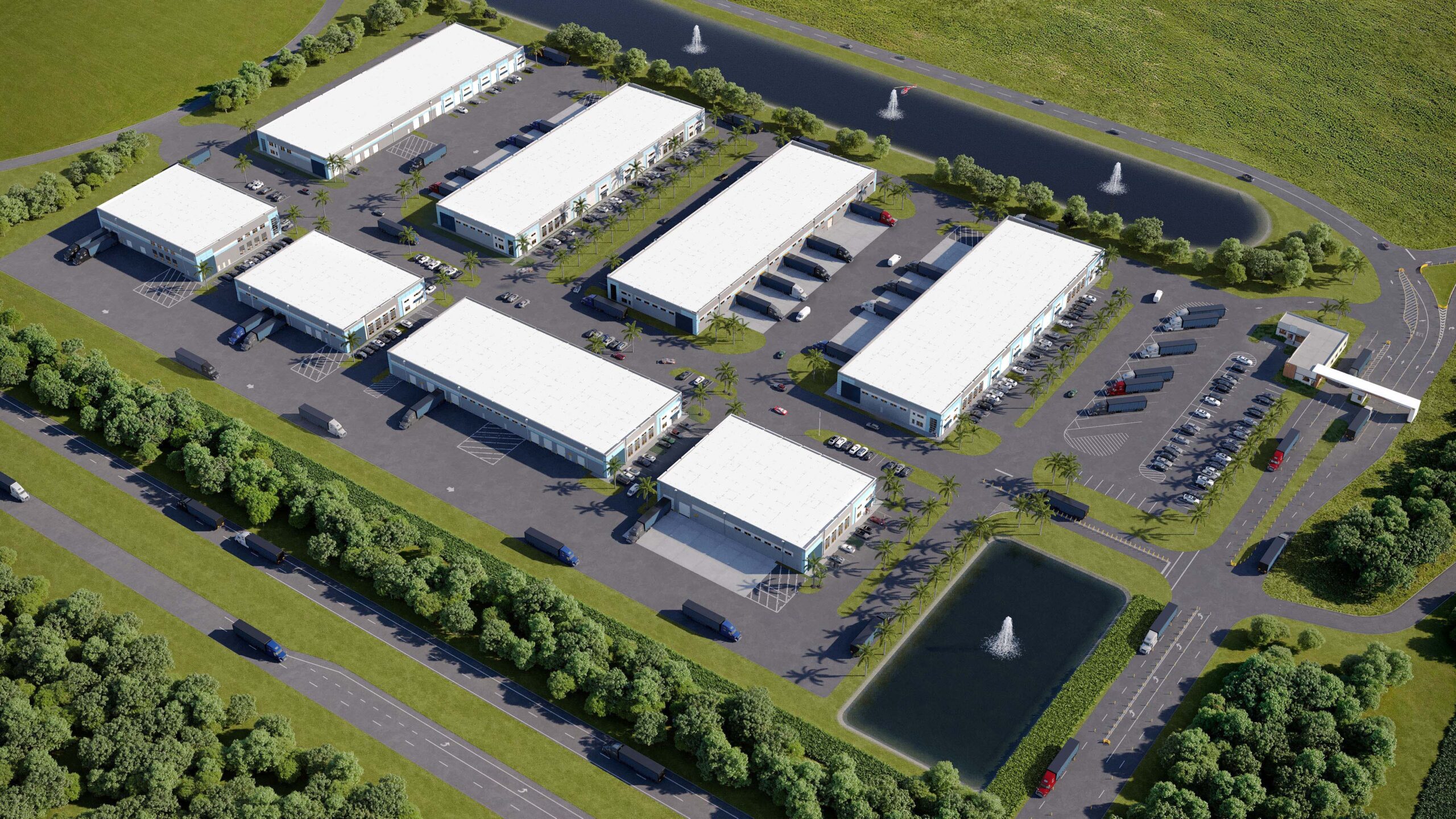 Aerial view of a multi-building commerce park with loading docks, parking areas, and retention ponds with fountains.