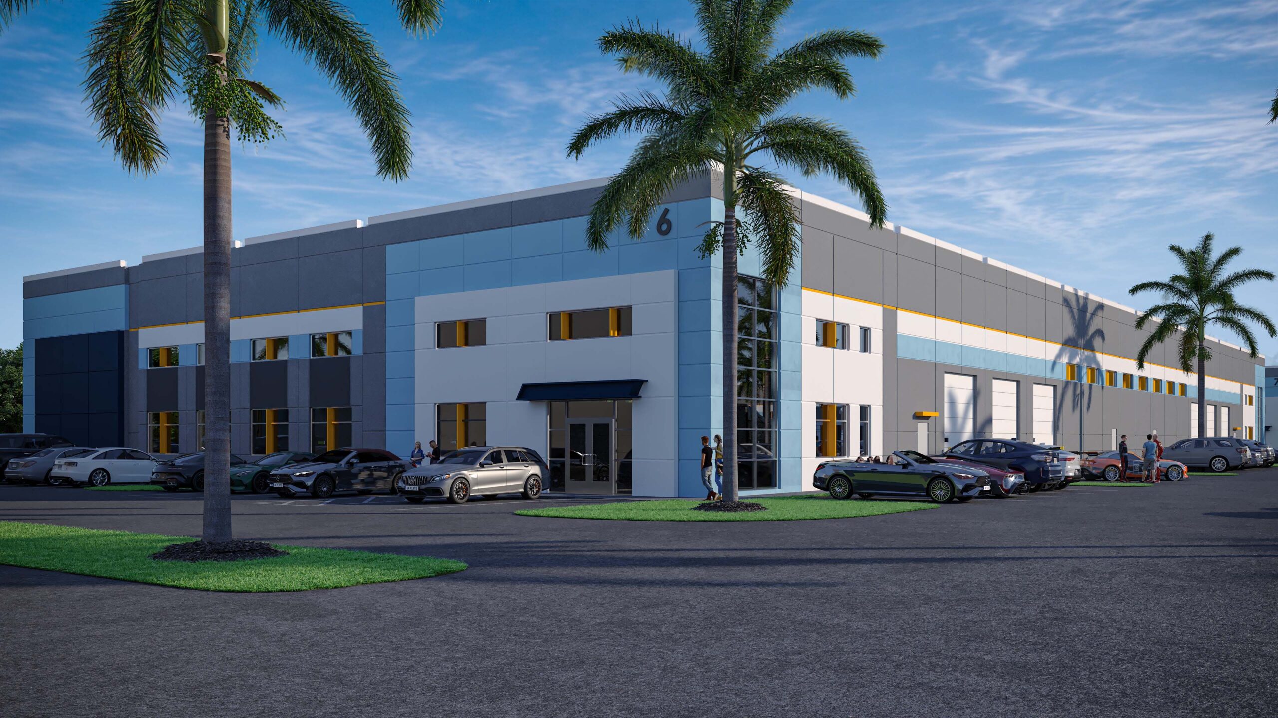 Commerce park building exterior with palm trees, luxury vehicles parked out front, and multiple bay doors.
