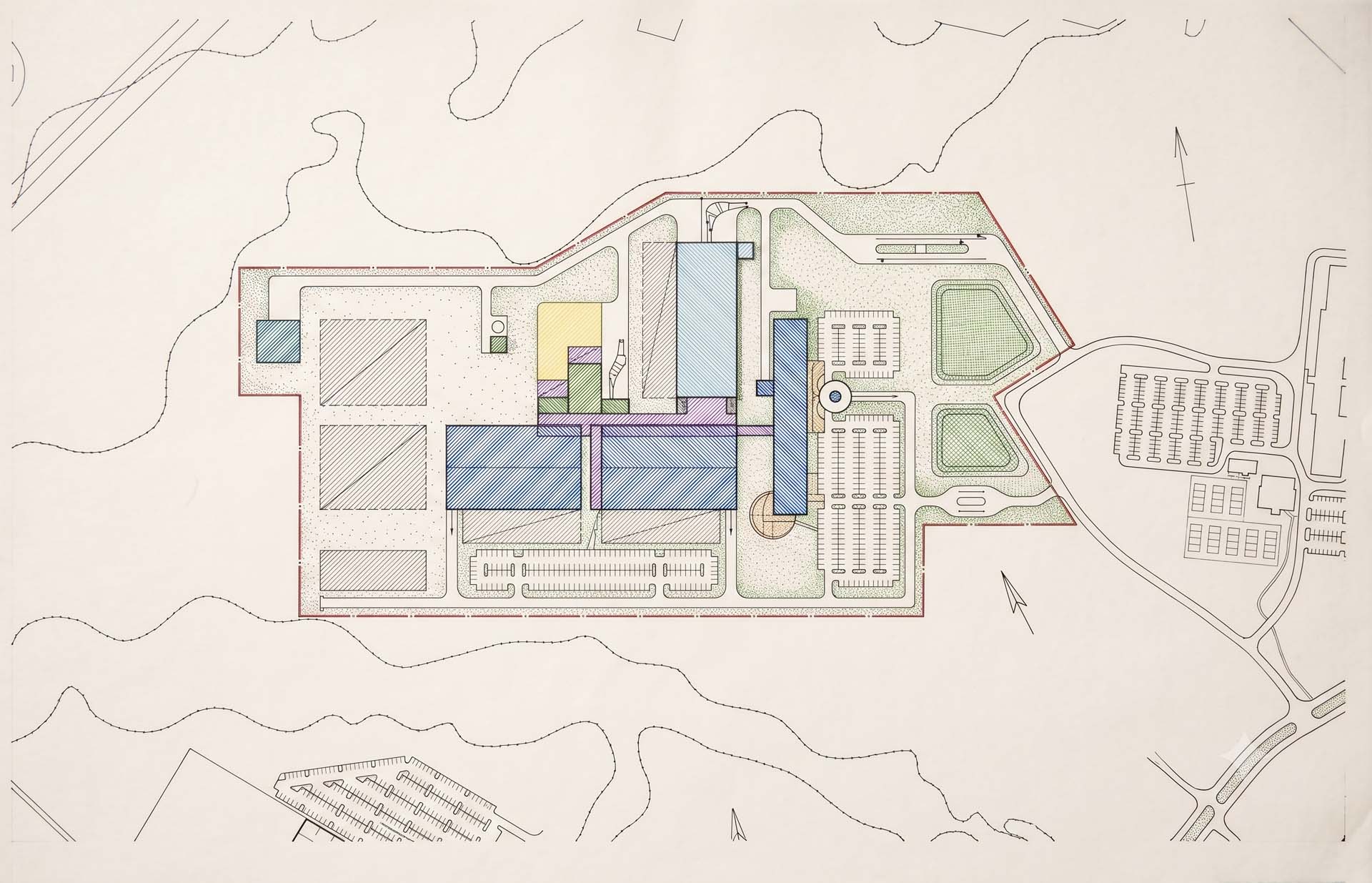 Hand-drawn colored site plan showing building layout, parking areas, and landscaping.