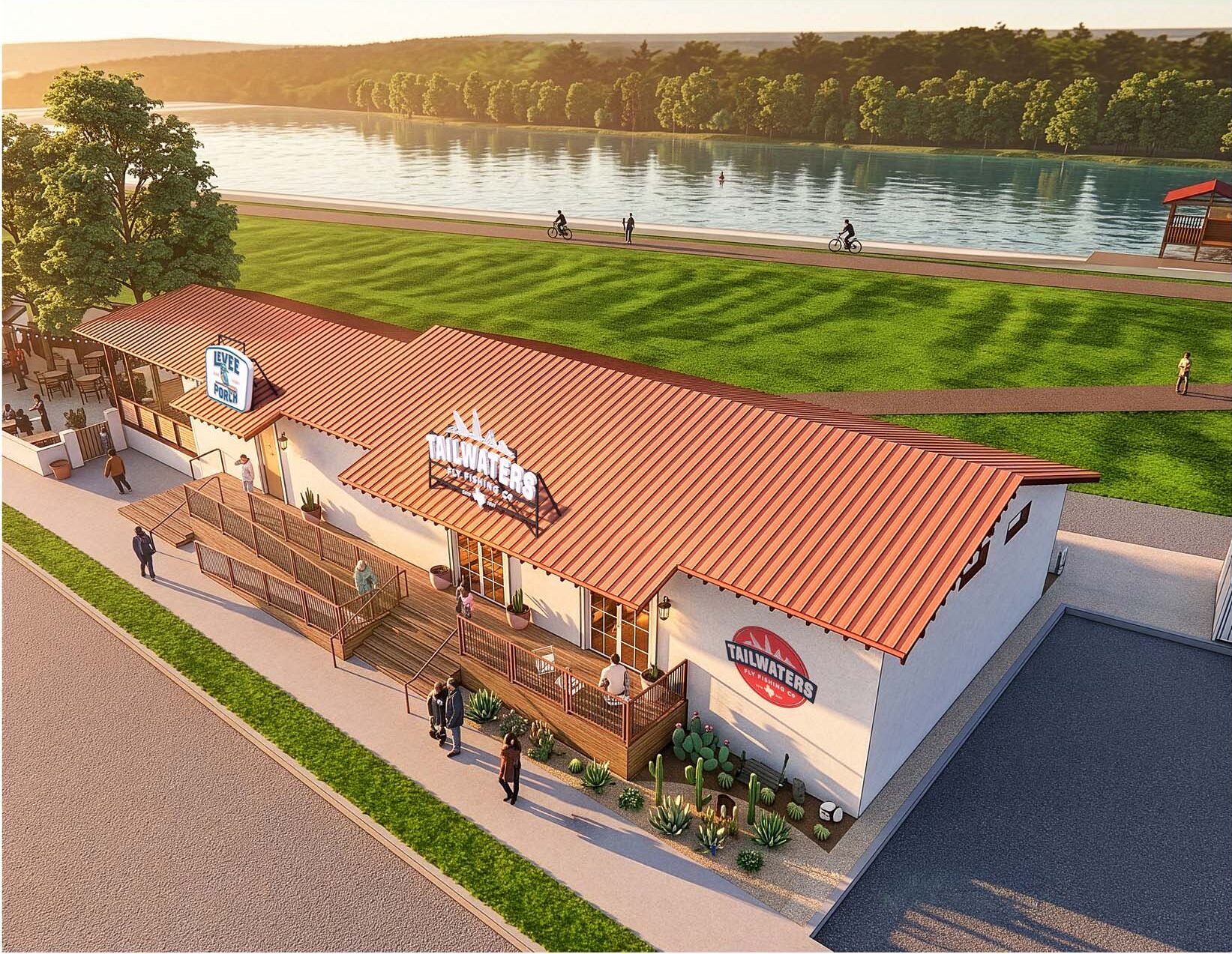 Aerial view of Levee Porch and Tailwaters Fly Fishing Co. building along a riverside path with a covered porch and desert landscaping.